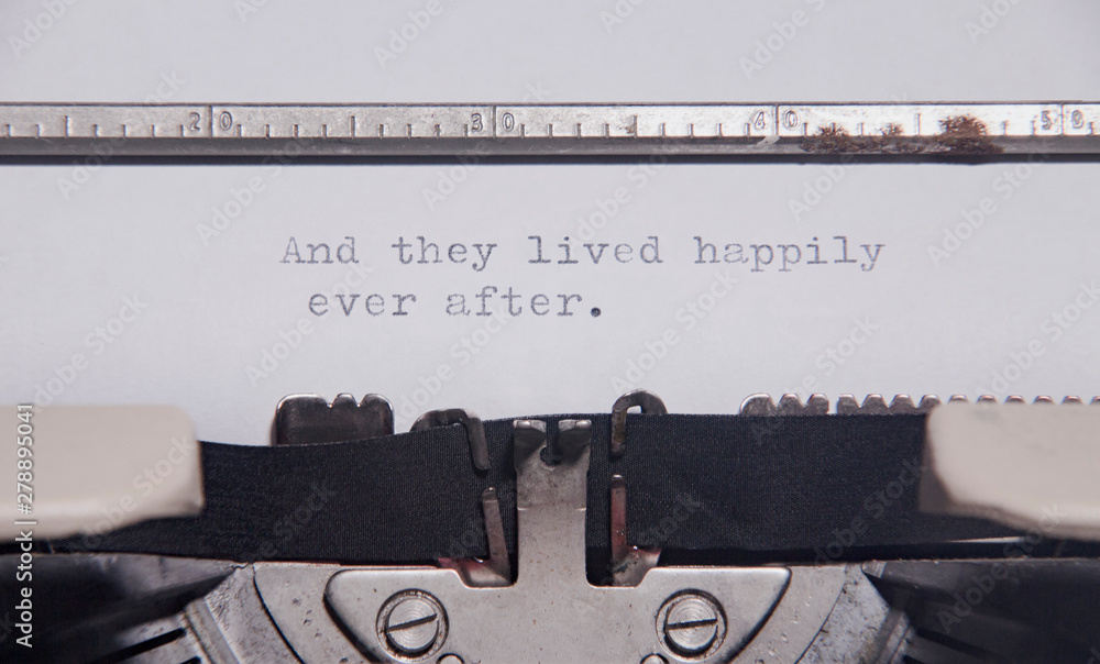 Αυτοκόλλητο The ending phrase And they lived happily ever after, printed on a paper page inside an old vintage typewriter