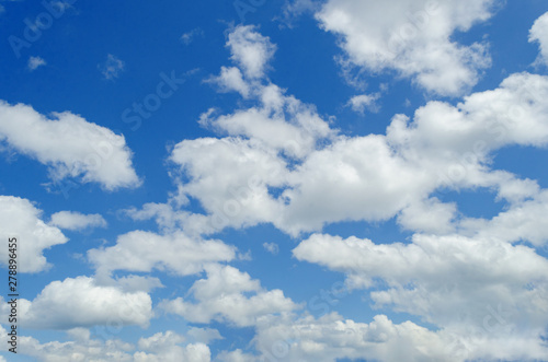 white clouds in the blue summer sky © DmitryDolgikh