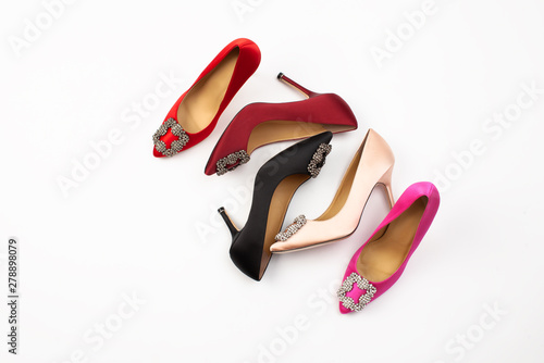 Colored classic women's shoes on white background