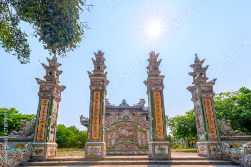 The ancient house with elaborate carved columns of pottery is a typical culture in Ke Vo cultural village, Hue, Vietnam. © huythoai