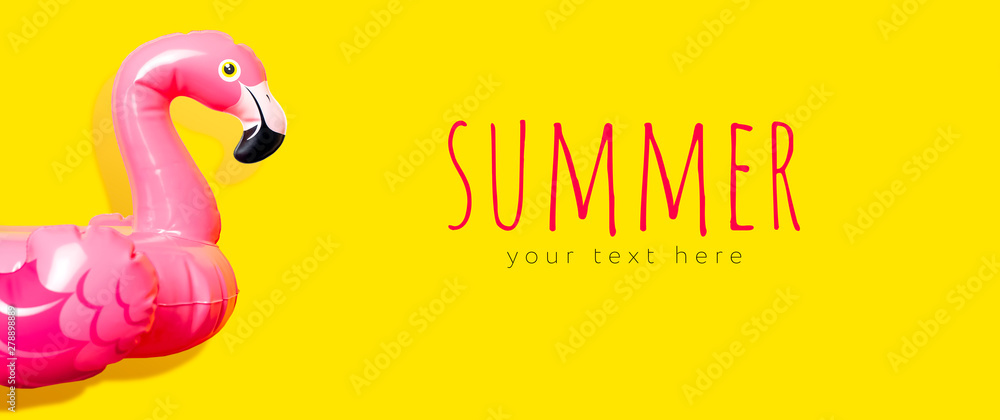 Creative summer beach concept. Inflatable pink mini flamingo on yellow background, pool float party. Flat lay, copy space. Flamingo Trend Inflatable Toy. Summer background. Layout for design Creative summer beach concept. Inflatable pink mini flamingo on yellow background, pool float party. Flat lay, copy space. Flamingo Trend Inflatable Toy. Summer background. Layout for design