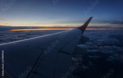 Sunset in the sky. View from the window of the window of the aircraft.