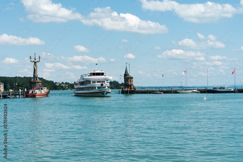 large passenger boat enters the historic harbor at Konstanz on Lake Constance