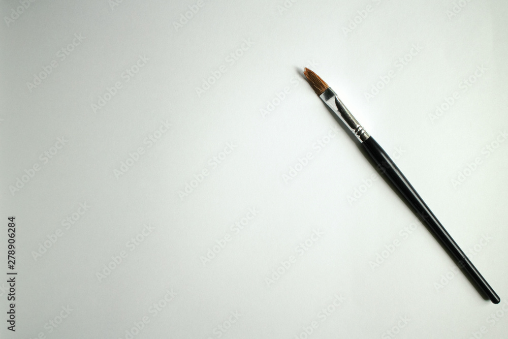 Paint brush with a blank paper for drawing, space for text Stock Photo