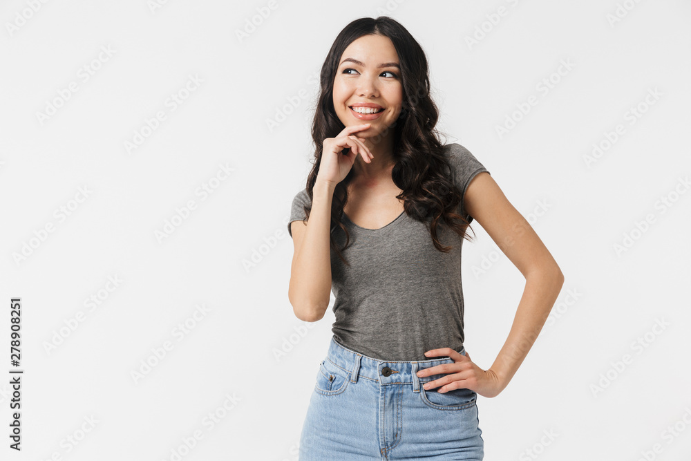 Excited happy young woman posing isolated over white wall background. Excited happy young woman posing isolated over white wall background.