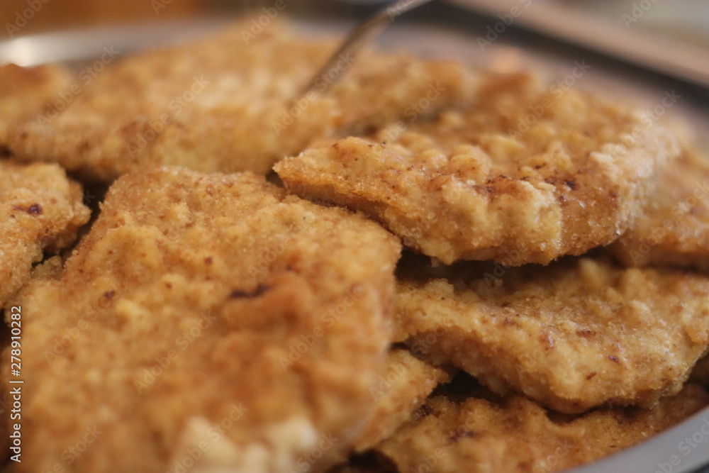 Tasty deep fried wiener schnitzel close up Tasty deep fried wiener schnitzel close up