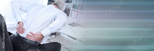 Businessman suffering from back pain; panoramic banner