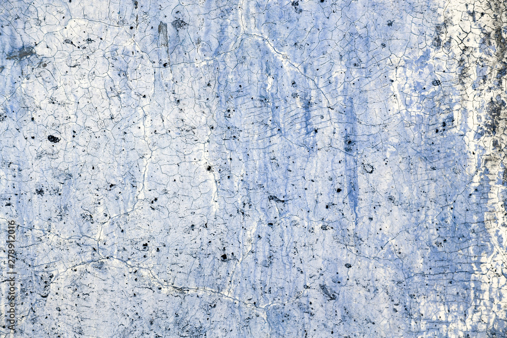 Abstract crack pattern on old cement wall background, concrete texture background with blue filter effect Abstract crack pattern on old cement wall background, concrete texture background with blue filter effect