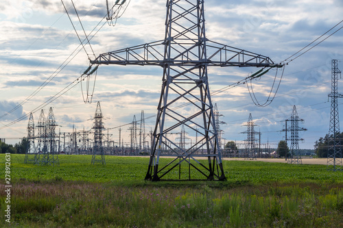 Group silhouette of transmission towers power tower, electricity pylon, steel lattice tower . Texture high voltage pillar, overhead power line.