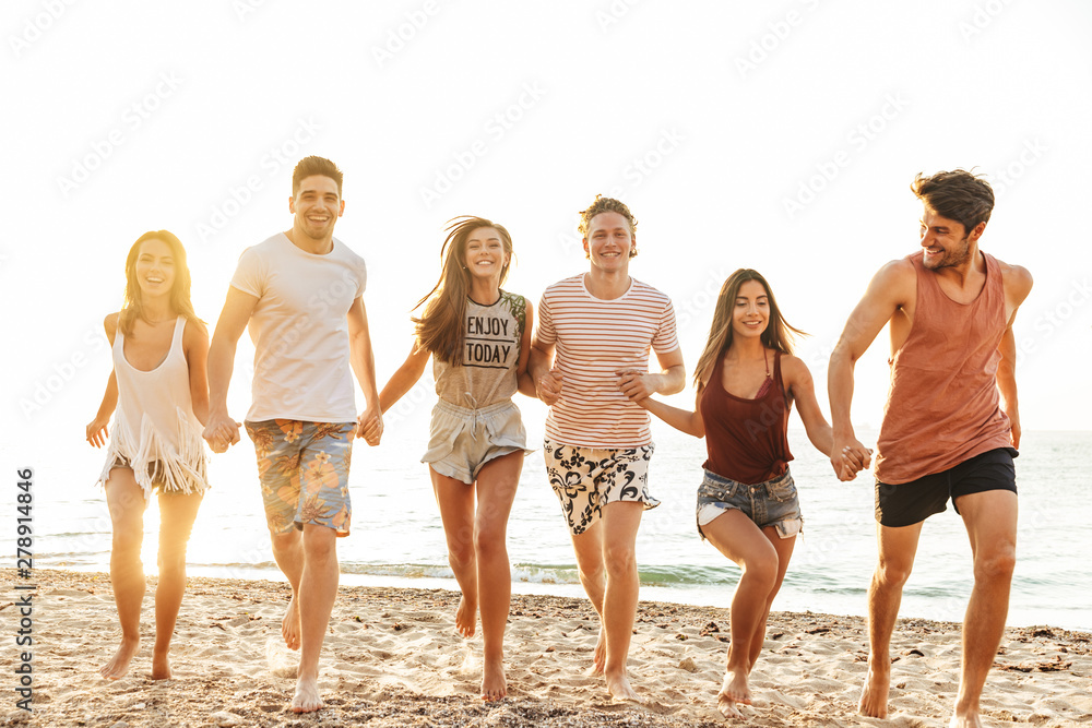 Group of cheerful happy young friends having fun Group of cheerful happy young friends having fun