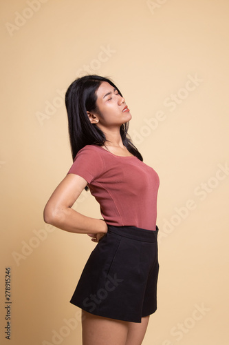 Young Asian woman got back pain.