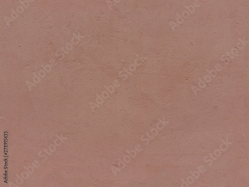 Textured plaster in terracotta color. High resolution seamless texture of stucco for background, pattern, poster, collage, gift wrap, wallpaper, photo layering etc.