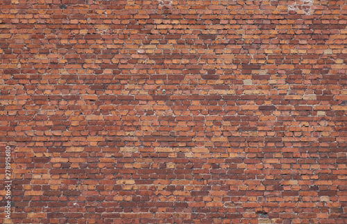 Old weathered red brick wall. High resolution seamless texture for background, pattern, poster, collage, gift wrap, wallpaper, photo layering etc.