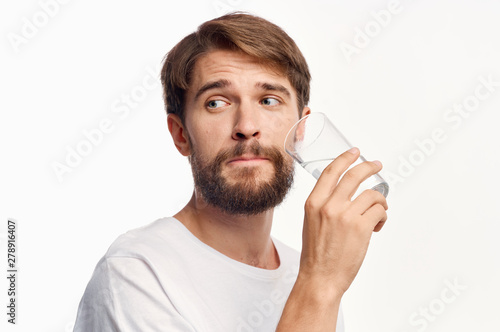 young man drinking a glass of milk