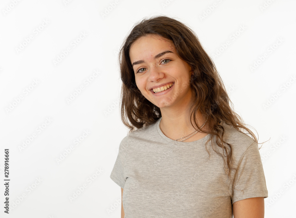 Human expressions and emotions. Portrait of young attractive girl with smiling happy face Human expressions and emotions. Portrait of young attractive girl with smiling happy face