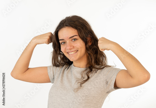Close up portrait of surprised and happy teenager woman celebrating victory and wining lottery