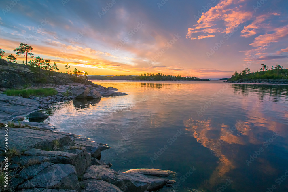 Karelia. Russia. Sunset on lake Ladoga. Evening sunset on the lake. Ladoga skerries. Rocky Islands in Ladoga lake. Karelian scenery. Nature of Karelia. Landscapes of Russia. Travel to Russia. Karelia. Russia. Sunset on lake Ladoga. Evening sunset on the lake. Ladoga skerries. Rocky Islands in Ladoga lake. Karelian scenery. Nature of Karelia. Landscapes of Russia. Travel to Russia.