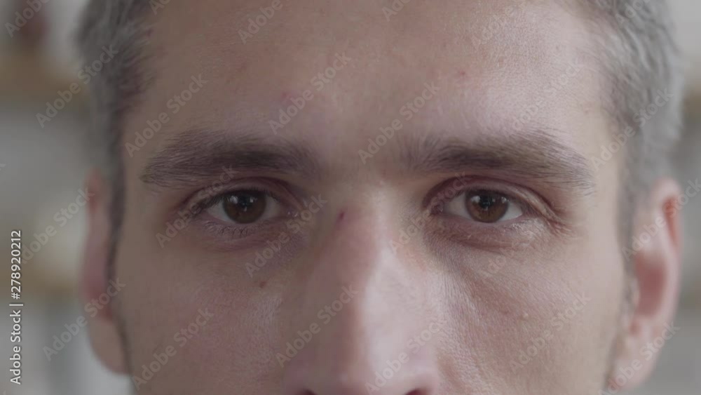 Cut face portrait of man looking at camera enjoying executive lifestyle on the background of a modern kitchen. Real people series. Cut face portrait of man looking at camera enjoying executive lifestyle on the background of a modern kitchen. Real people series.