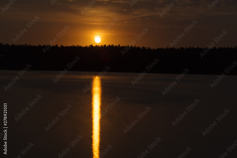 Night landscape of moon rise over calm lake Night landscape of moon rise over calm lake