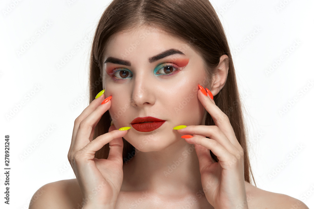 Closeup portrait of beautiful young woman with bright color make-up and manicure Closeup portrait of beautiful young woman with bright color make-up and manicure