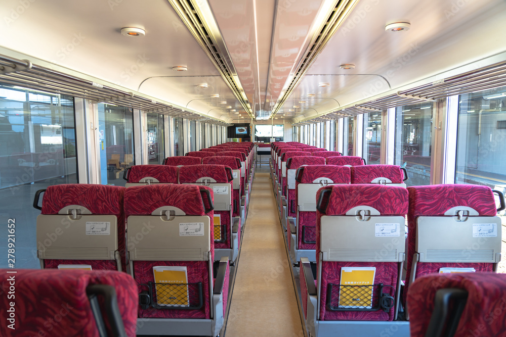 Interior of East Japan Railway Gono line Resort Shirakami sightseeing train in Akita station. the train rides from Akita to Aomori, operated by the East JR company Interior of East Japan Railway Gono line Resort Shirakami sightseeing train in Akita station. the train rides from Akita to Aomori, operated by the East JR company