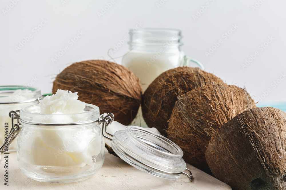 Coconut butter on wooden background. Organic healthy food concept Coconut butter on wooden background. Organic healthy food concept