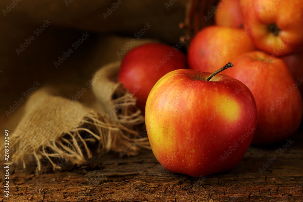 Big red- yellow apple are on a background of dark wood selective fokus. Big red- yellow apple are on a background of dark wood selective fokus.