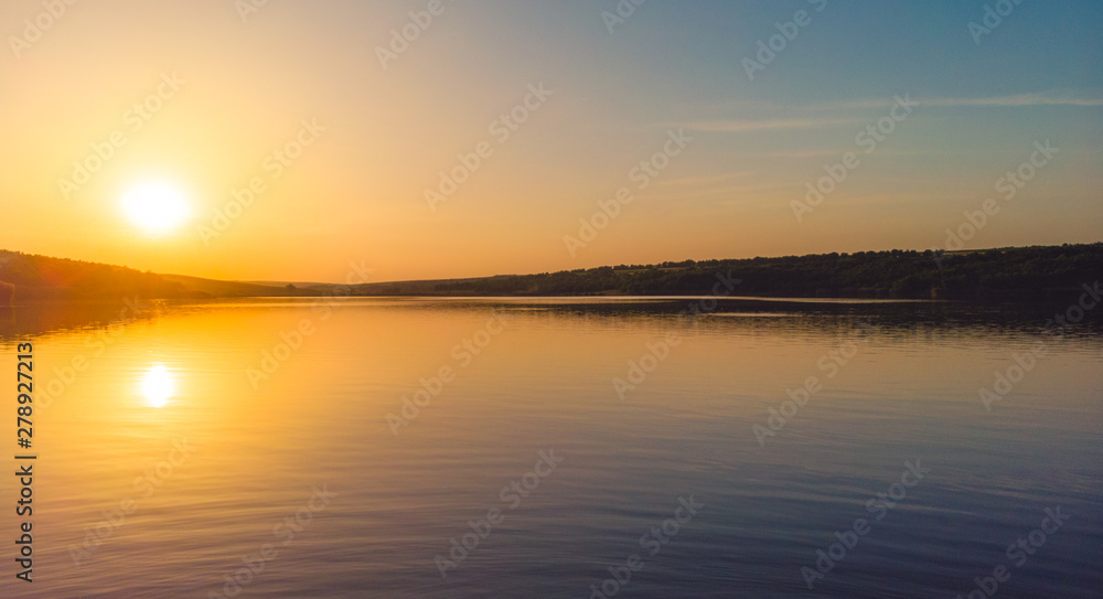 Sunset on the edge of a lake in the country, Moldova, 2019 Sunset on the edge of a lake in the country, Moldova, 2019