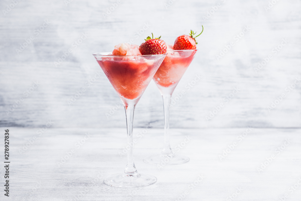 Frozen strawberry cocktail in martini glass. Selective focus. Frozen strawberry cocktail in martini glass. Selective focus.