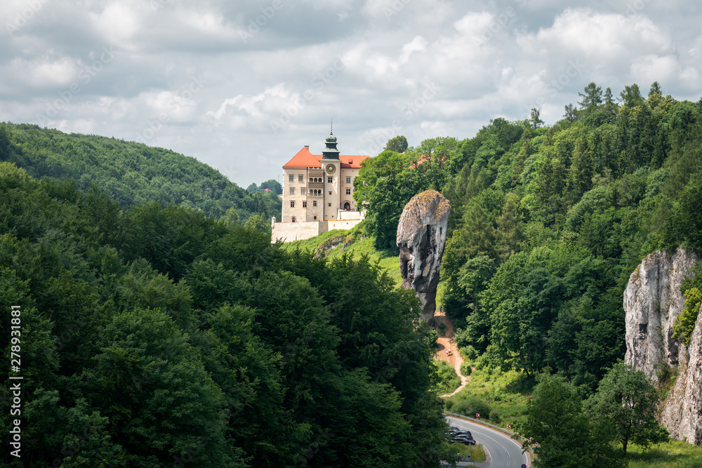 Castle on the hill in Ojcow National Park Poland - Pieskowa Skala, Hercules's mace rock Castle on the hill in Ojcow National Park Poland - Pieskowa Skala, Hercules's mace rock