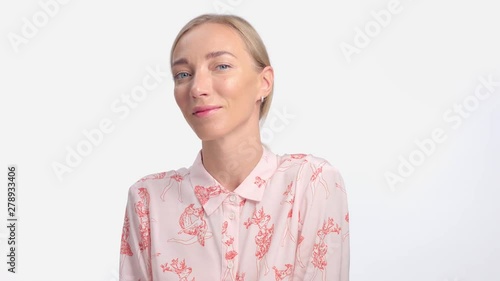 panned portrait of young woman turnes to the camera and watching to the camera. Natural makeup photo