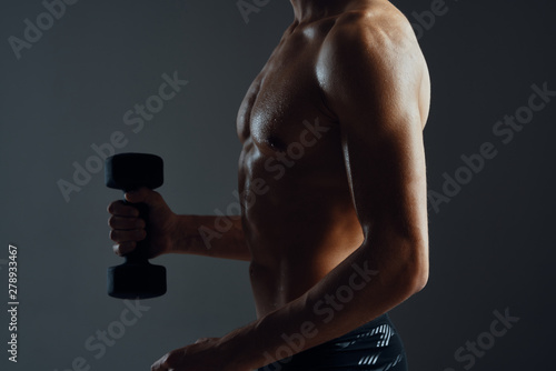 muscular man with dumbbell © SHOTPRIME STUDIO