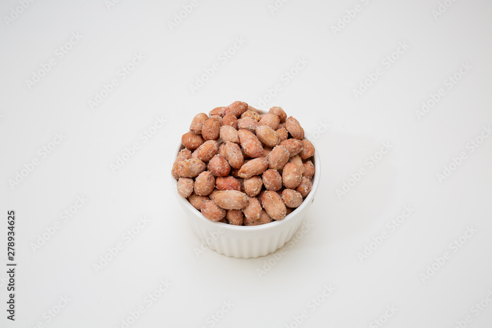 nuts in a bowl isolated on white background nuts in a bowl isolated on white background