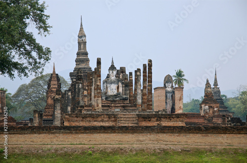 Ruins of unique temples in famous Sukhothai Historical Park, a UNESCO World Heritage Site, Foggy spring day in the ancient 13th and 14th centuries capital of Sukhothai. Thailand © Alena Charykova