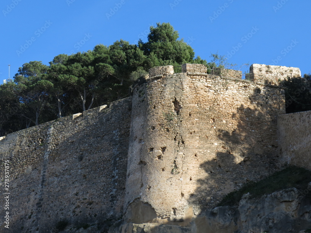 Ancient wall surrounding the Castillo de Denia, Spain