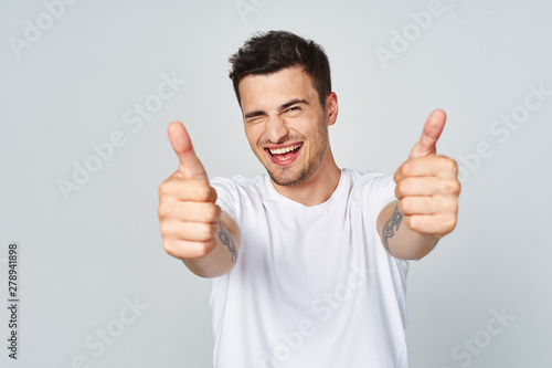 young man with thumbs up © SHOTPRIME STUDIO