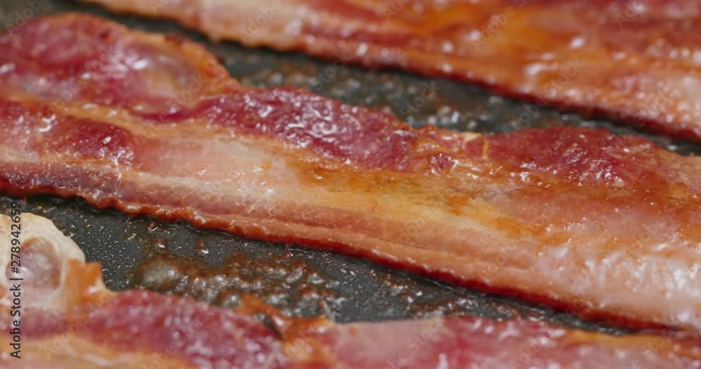 Fry bacon in pan in kitchen for breakfast Fry bacon in pan in kitchen for breakfast
