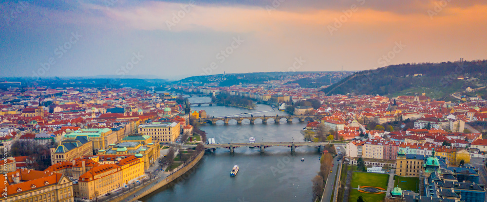 Aerial Panoramic View over The Prague City at Sunset Time, River, Bridges, Castle and Old Town, Czech Republic