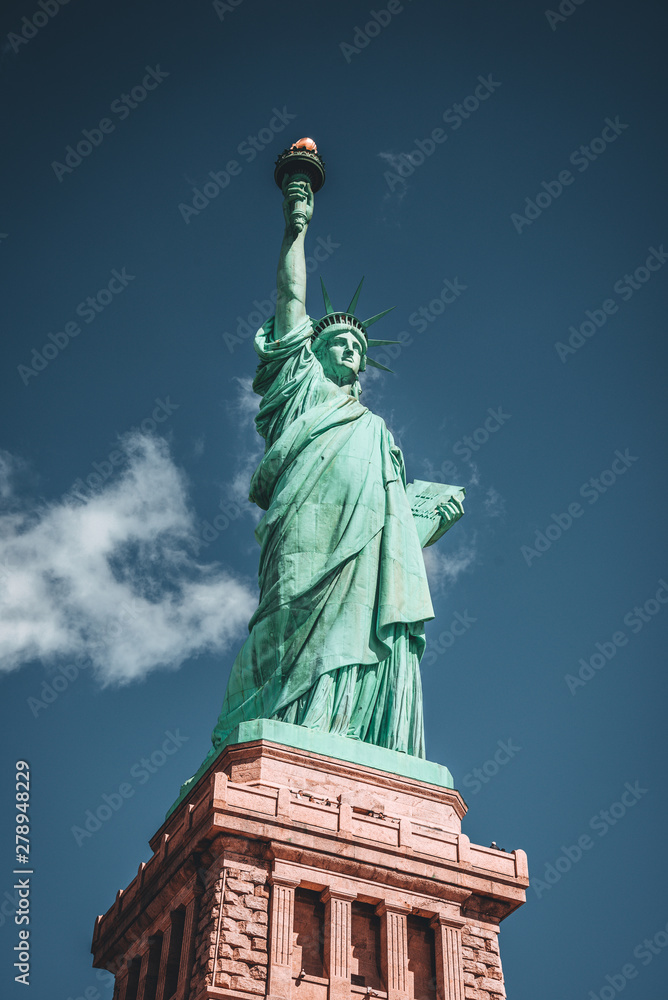 Geometric Front View of the Statue of Liberty with cloud on blue sky background
