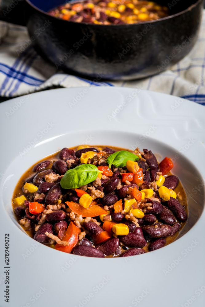 Chili corn carne on stone table Chili corn carne on stone table