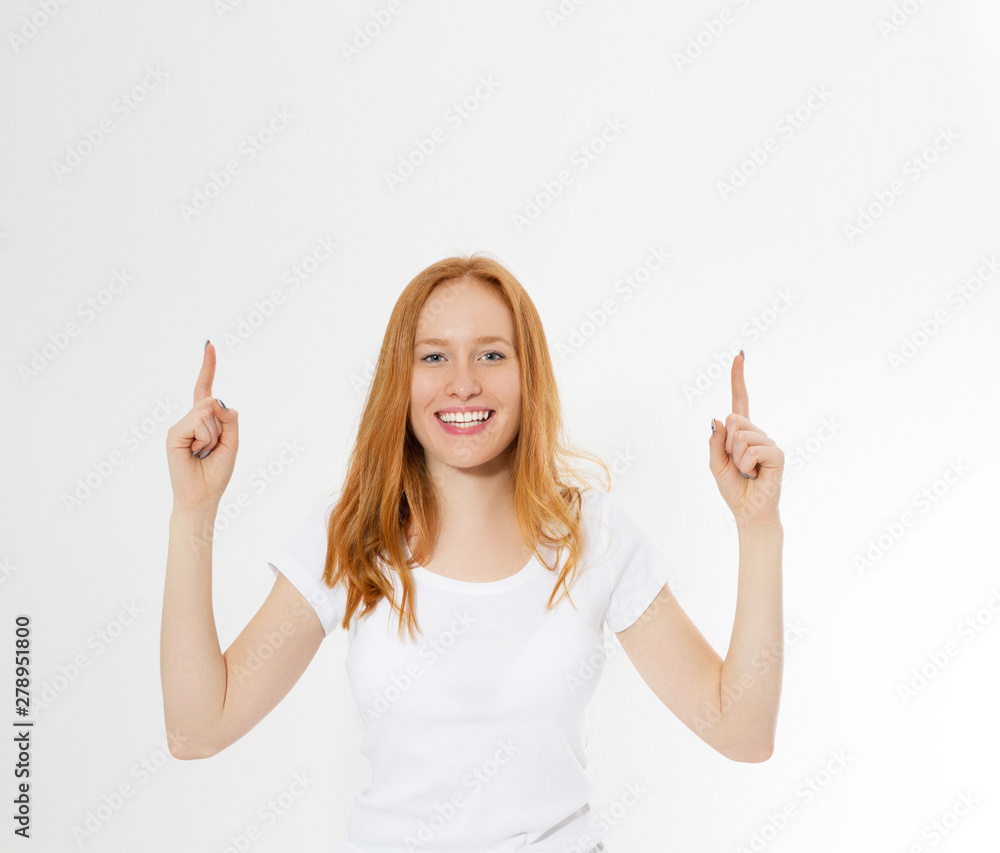 Photo smiling red hair lady isolated on white background pointing her fingers up, having great innovative idea, understanding or solution she has just got. Copy space. Photo smiling red hair lady isolated on white background pointing her fingers up, having great innovative idea, understanding or solution she has just got. Copy space.