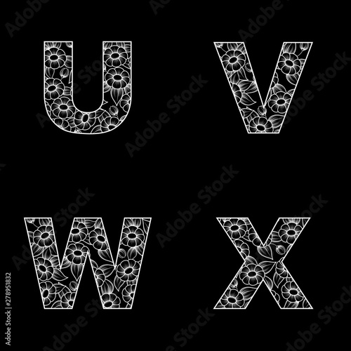 Four white outline letters with floral patter isolated on black background