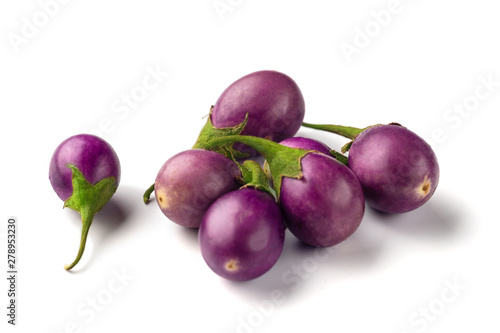Group of baby purple eggplants on white background