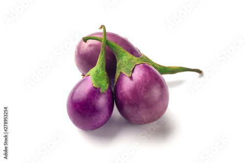 Group of baby purple eggplants on white background