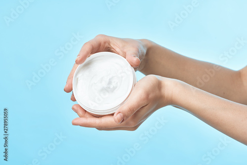 hand holding a clock isolated on white background