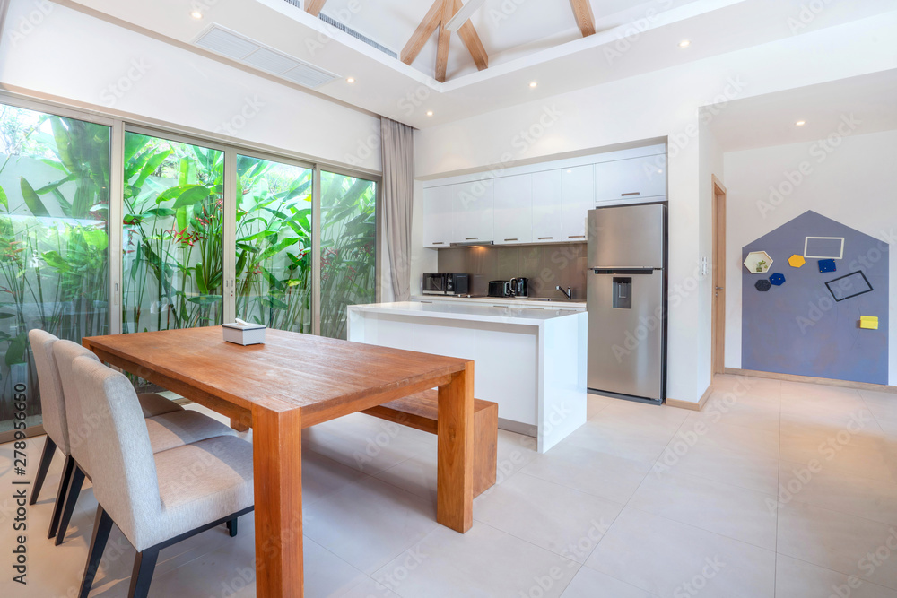 Fototapeta premium interior design in living room with open kitchen area