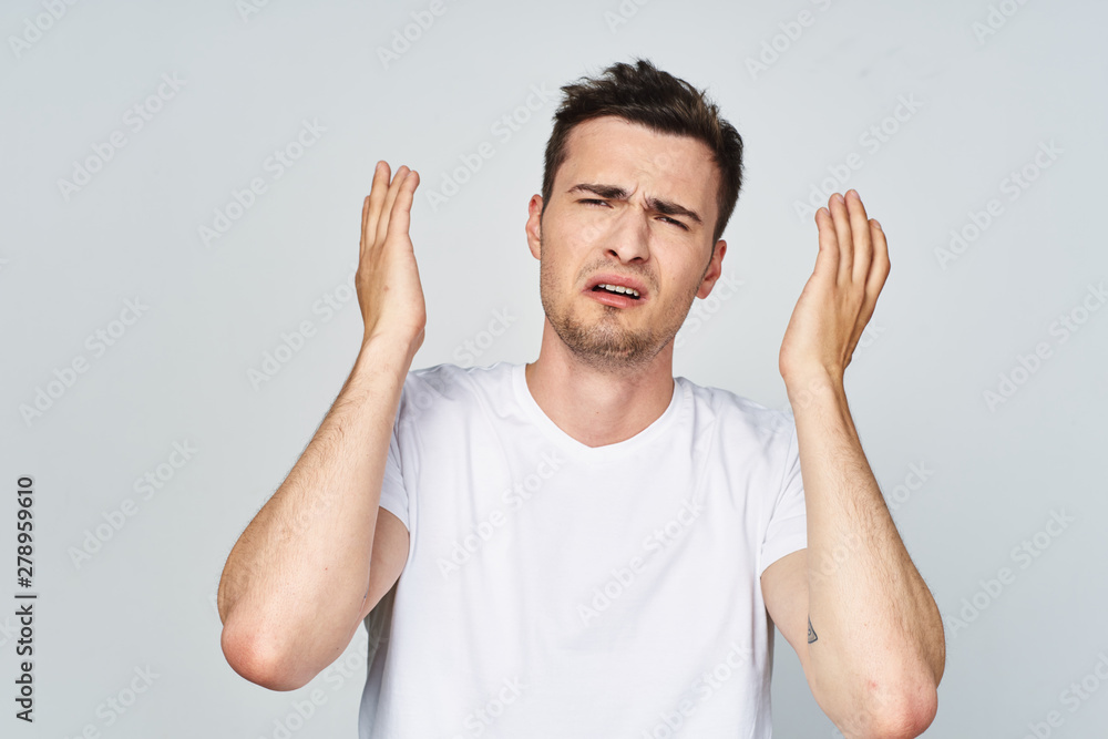 young man with hands up young man with hands up