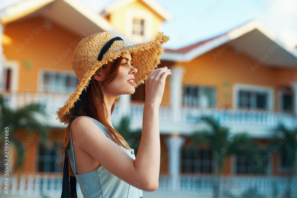 young woman in hat on the beach