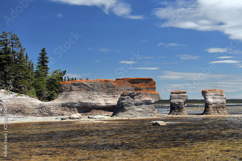 ROCK MONOLITES. Tourists from all over the world come to the Mingan archipelago to see the ROCK MONOLITES on the Canadian coast in the province of Quebec.