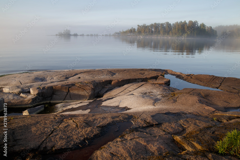 Morning misty landscape on the lake, Valaam, Karelia, Russia.